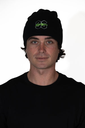 Person wearing a black beanie with a logo on a white background