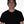Man wearing a black cap and black t-shirt against a white background